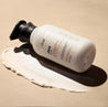 refillable shea body lotion in recycled plastic bottle